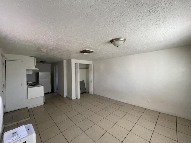 interior space with a textured ceiling