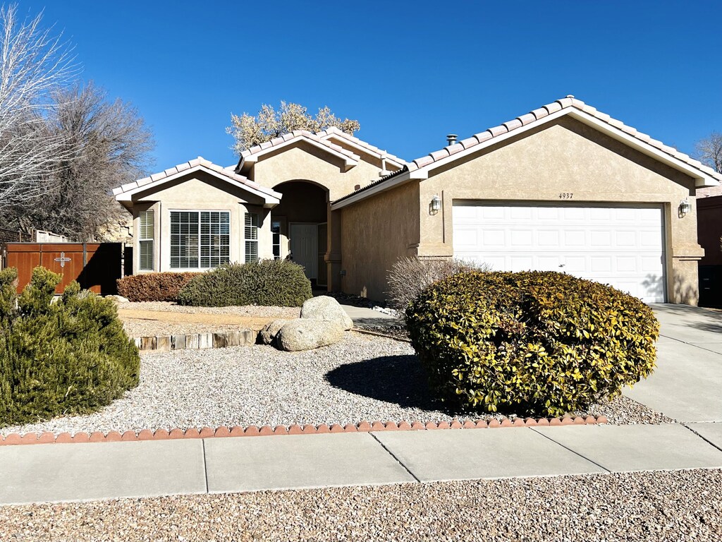 ranch-style house featuring a garage