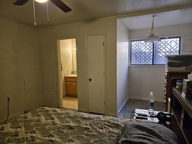 bedroom with ceiling fan and ensuite bathroom