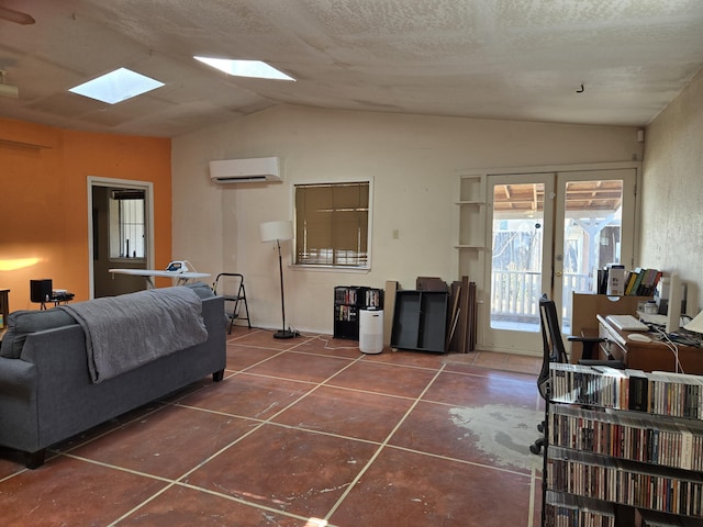 tiled living room with a wall mounted air conditioner, french doors, and vaulted ceiling with skylight