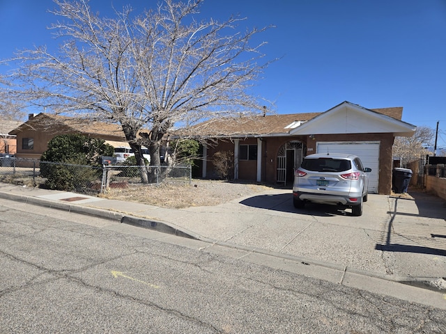 single story home with a garage