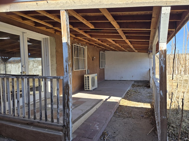 exterior space with ac unit and an outbuilding