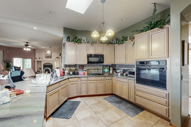 kitchen featuring light tile patterned flooring, black appliances, hanging light fixtures, ceiling fan with notable chandelier, and backsplash