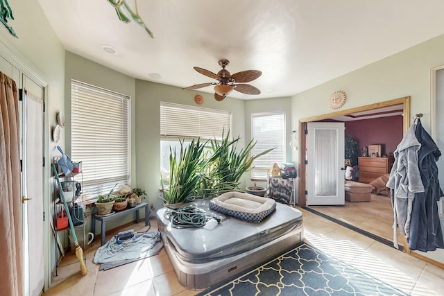 interior space with ceiling fan and tile patterned floors