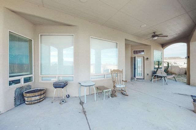 view of patio featuring ceiling fan