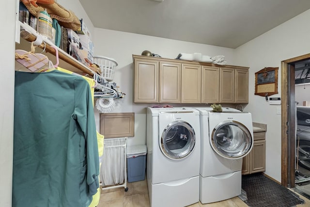 laundry room with cabinets and separate washer and dryer