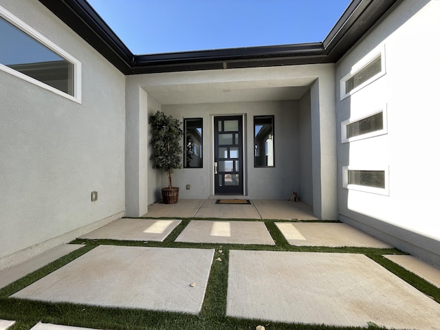 doorway to property featuring a patio area