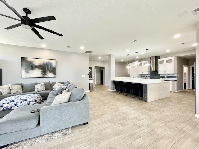 living room featuring ceiling fan