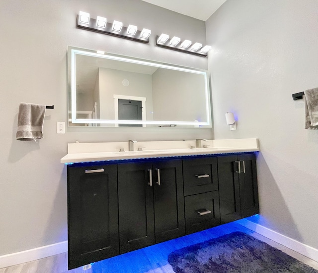 bathroom featuring vanity and hardwood / wood-style floors