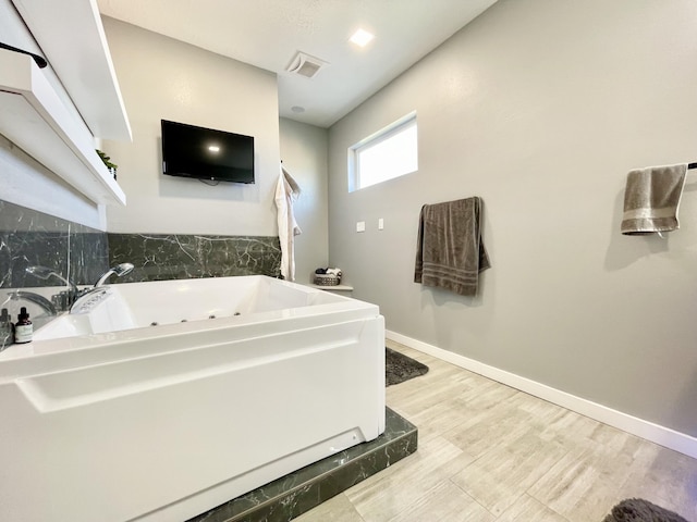 bathroom featuring a tub