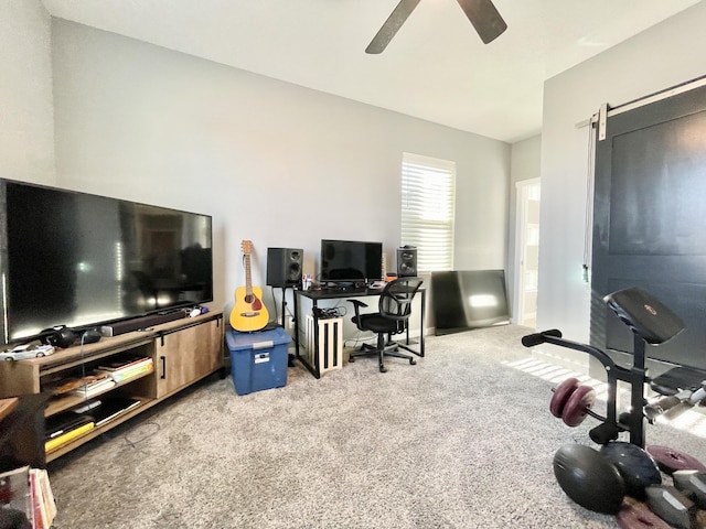 home office with light carpet and ceiling fan