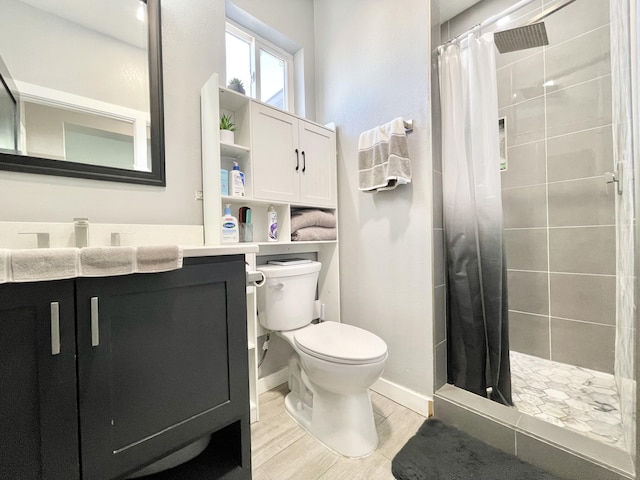 bathroom featuring vanity, toilet, and a shower with shower curtain