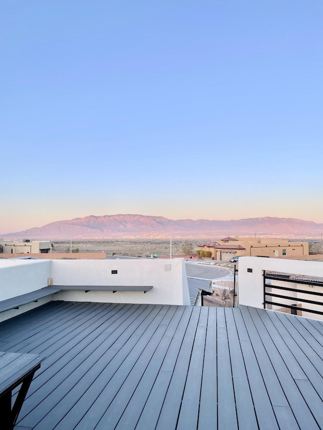 deck at dusk with a mountain view