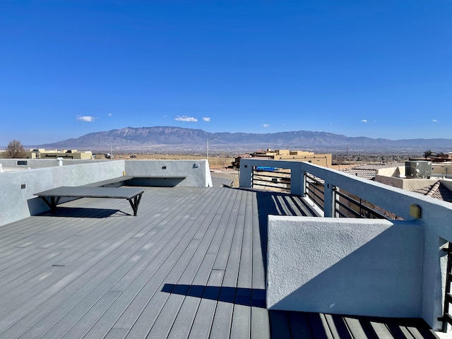 wooden deck featuring a mountain view