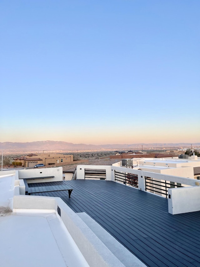 deck at dusk with a mountain view