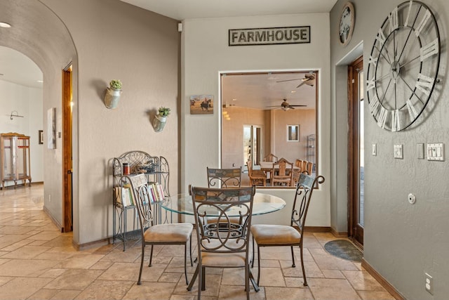 dining space with ceiling fan