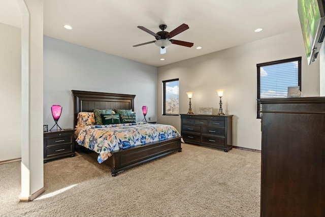 carpeted bedroom with ceiling fan