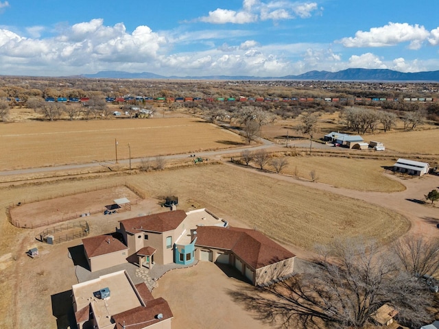 drone / aerial view with a mountain view and a rural view