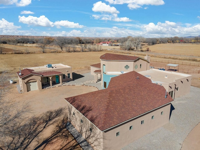 birds eye view of property featuring a rural view