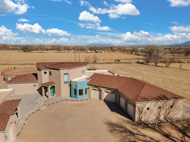 bird's eye view featuring a rural view and a mountain view