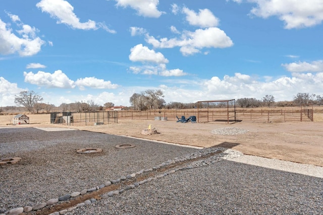 view of yard with a rural view