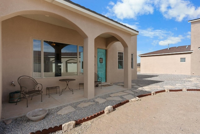 rear view of house featuring a patio