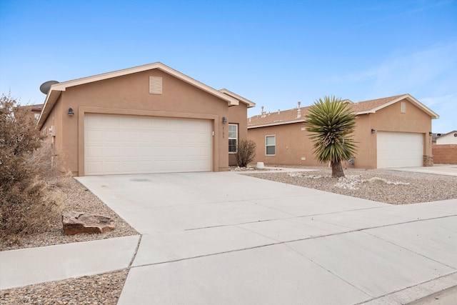 ranch-style house featuring a garage