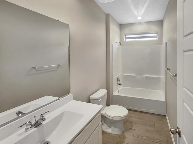 full bathroom featuring vanity, toilet, and  shower combination