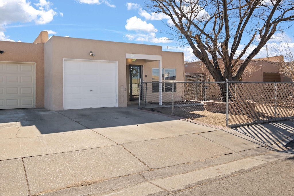 southwest-style home with a garage