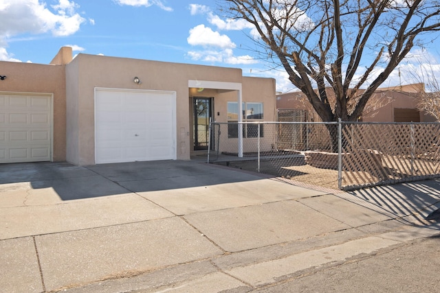 southwest-style home with a garage