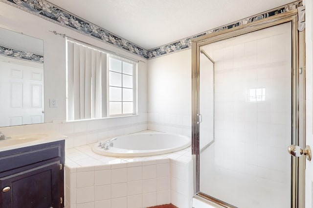 bathroom with vanity and separate shower and tub