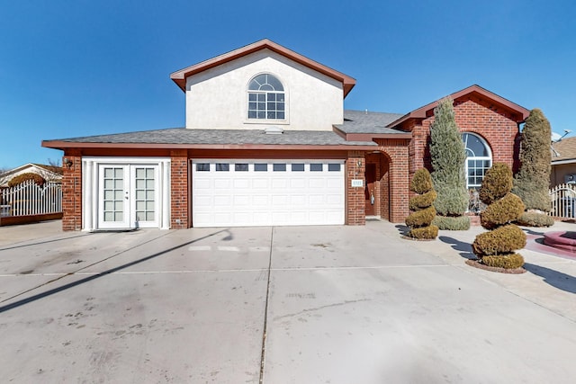 view of front of house with a garage and french doors