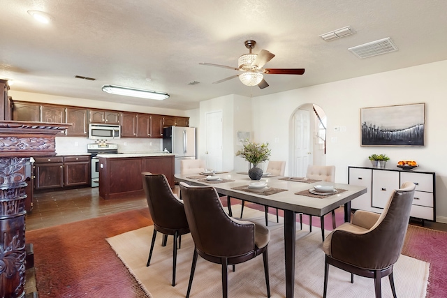 tiled dining room with ceiling fan