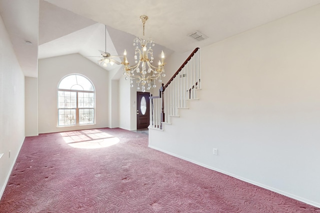 carpeted foyer entrance featuring an inviting chandelier and vaulted ceiling