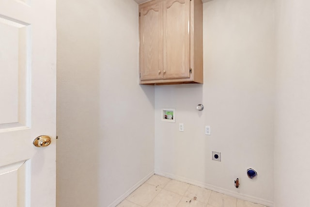 washroom with gas dryer hookup, cabinets, hookup for a washing machine, and hookup for an electric dryer