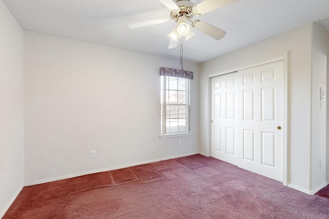 unfurnished bedroom featuring ceiling fan, carpet flooring, and a closet