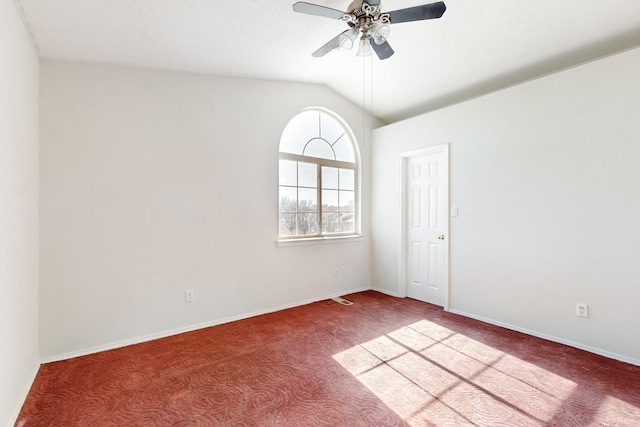 unfurnished room featuring lofted ceiling, ceiling fan, and carpet