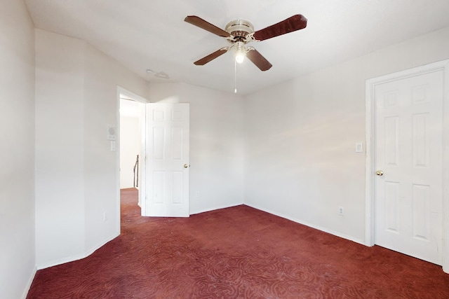 carpeted empty room with ceiling fan