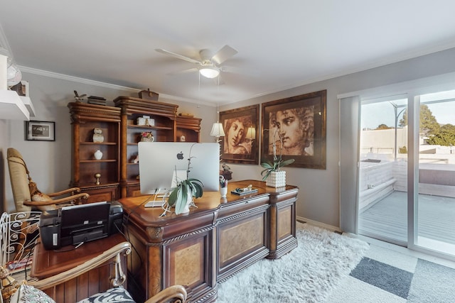 home office with crown molding, ceiling fan, and light colored carpet