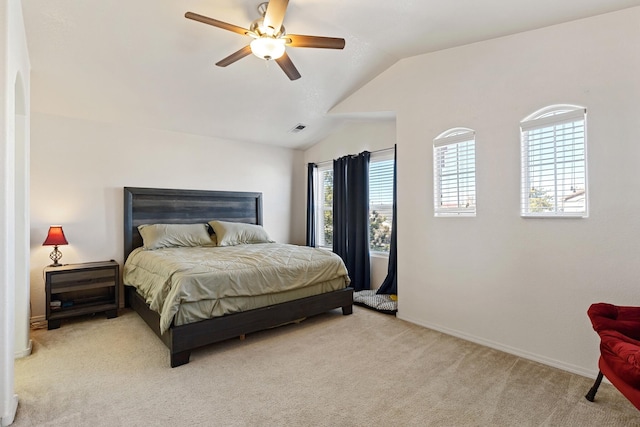 carpeted bedroom with lofted ceiling and ceiling fan