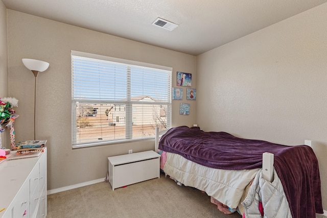 bedroom with light carpet