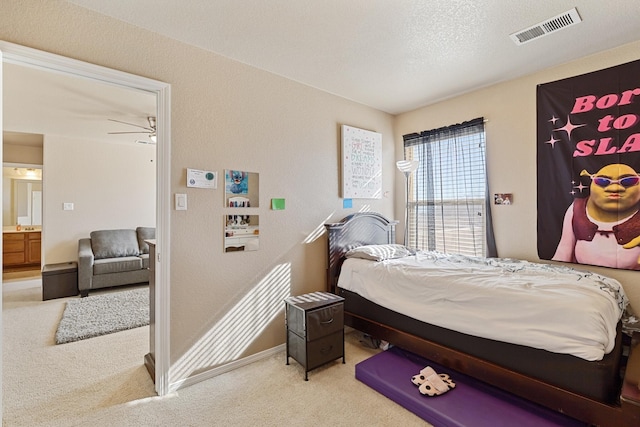 carpeted bedroom featuring a textured ceiling