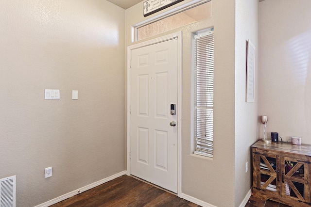 entrance foyer with dark hardwood / wood-style floors