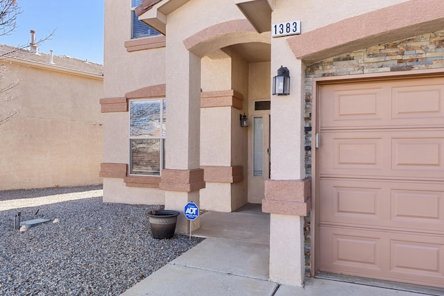 property entrance with a garage