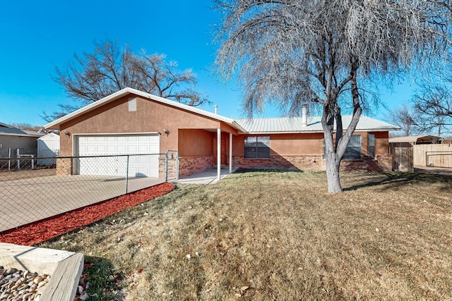 ranch-style home with a garage and a front lawn