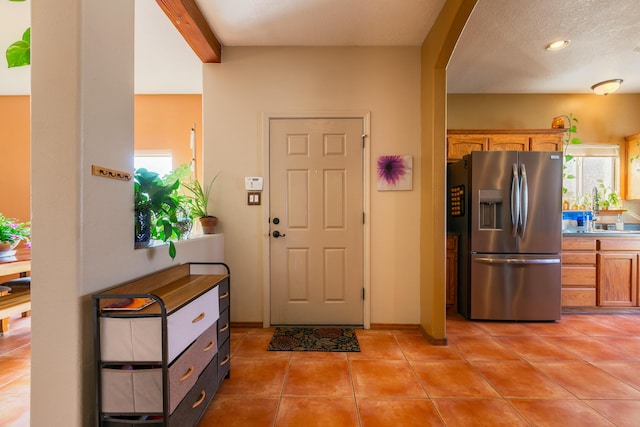 entrance foyer featuring light tile patterned floors