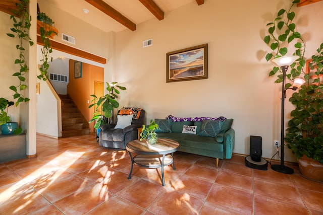 tiled living room with beam ceiling