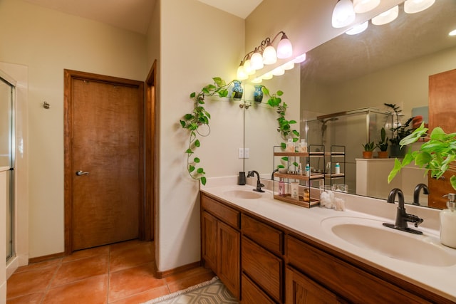 bathroom featuring vanity, tile patterned floors, and a shower with shower door