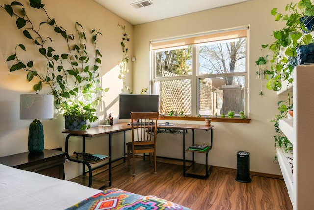 bedroom with hardwood / wood-style floors