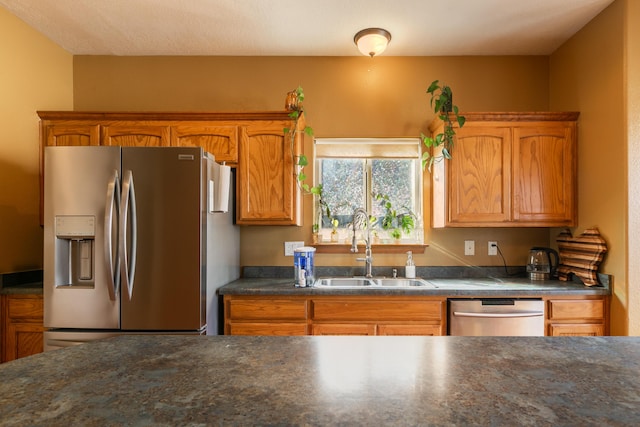 kitchen with appliances with stainless steel finishes and sink